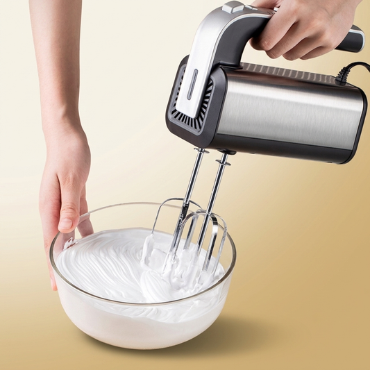 Mini Electric Whisk on warm gold-sand background