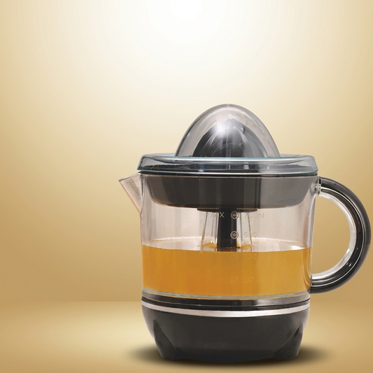 Manual Juicer on warm gold-sand background